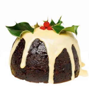 christmas pudding with custard --- Image by © Royalty-Free/Corbis