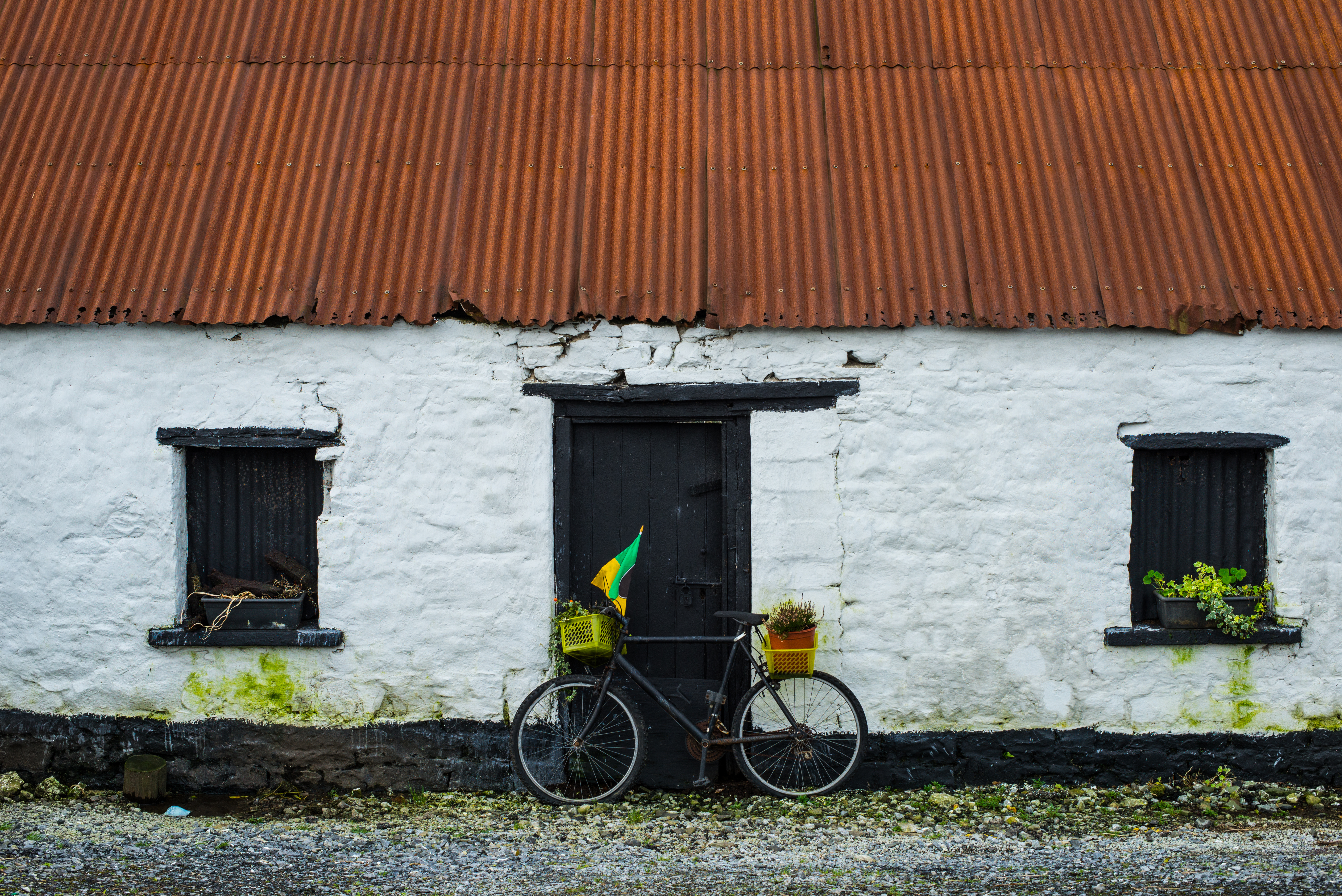 Old Irish stone cottage and bicycle background